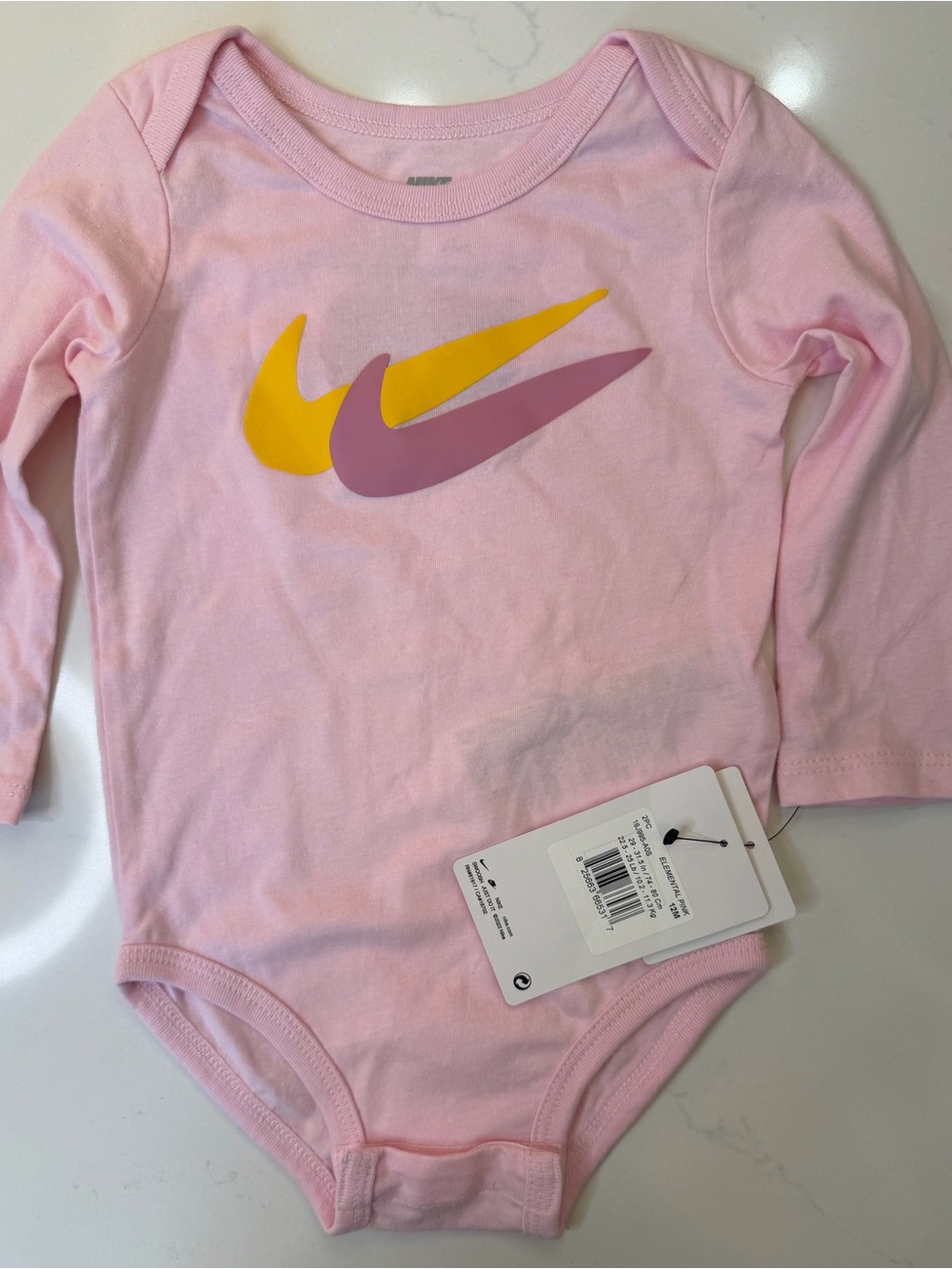 Nike Pink Long-Sleeve Baby One-Piece with Yellow and Mauve Swooshes